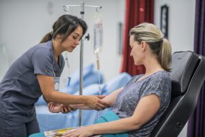 Doctor Giving IV Treatment to Patient