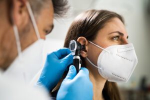 Otolaryngology Doctor Examining Patient's Ear