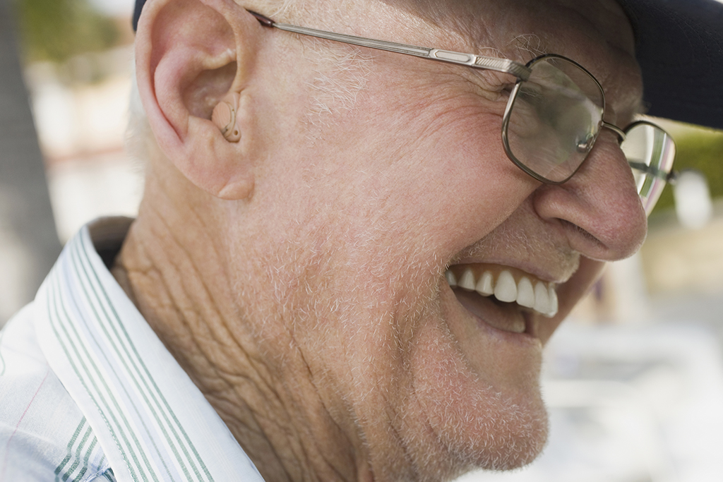 Senior man wearing a hearing aid