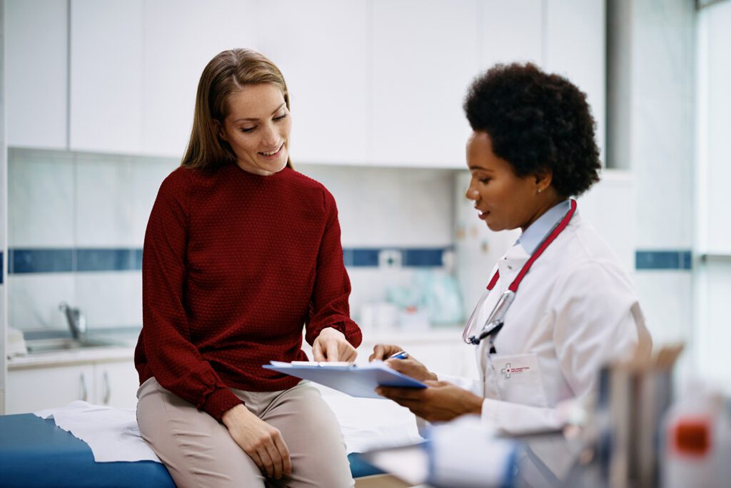 Woman going over health with physician