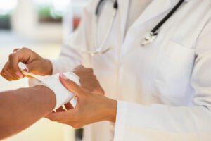 Medical professional wrapping a patient's wrist