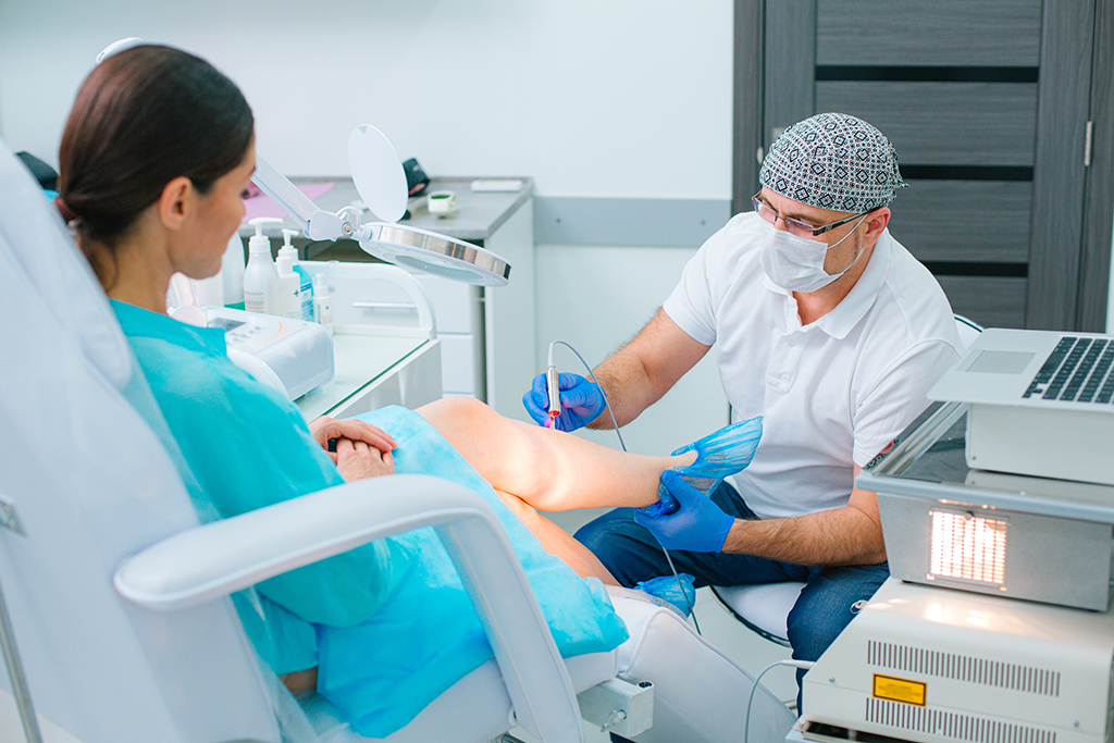 Young female undergoing laser spider veins removal