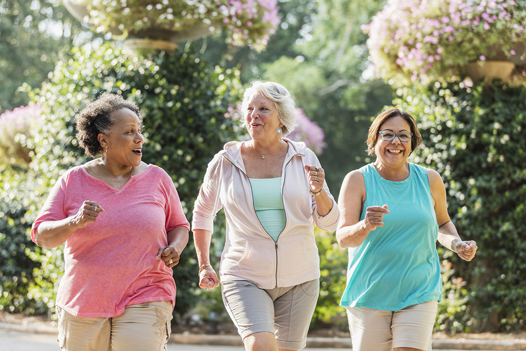 Multi-ethnic senior women exercise walking together