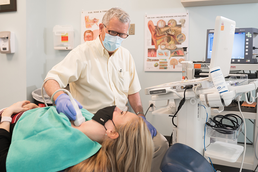 Image of Michael Parker performing a thyroid ultrasound