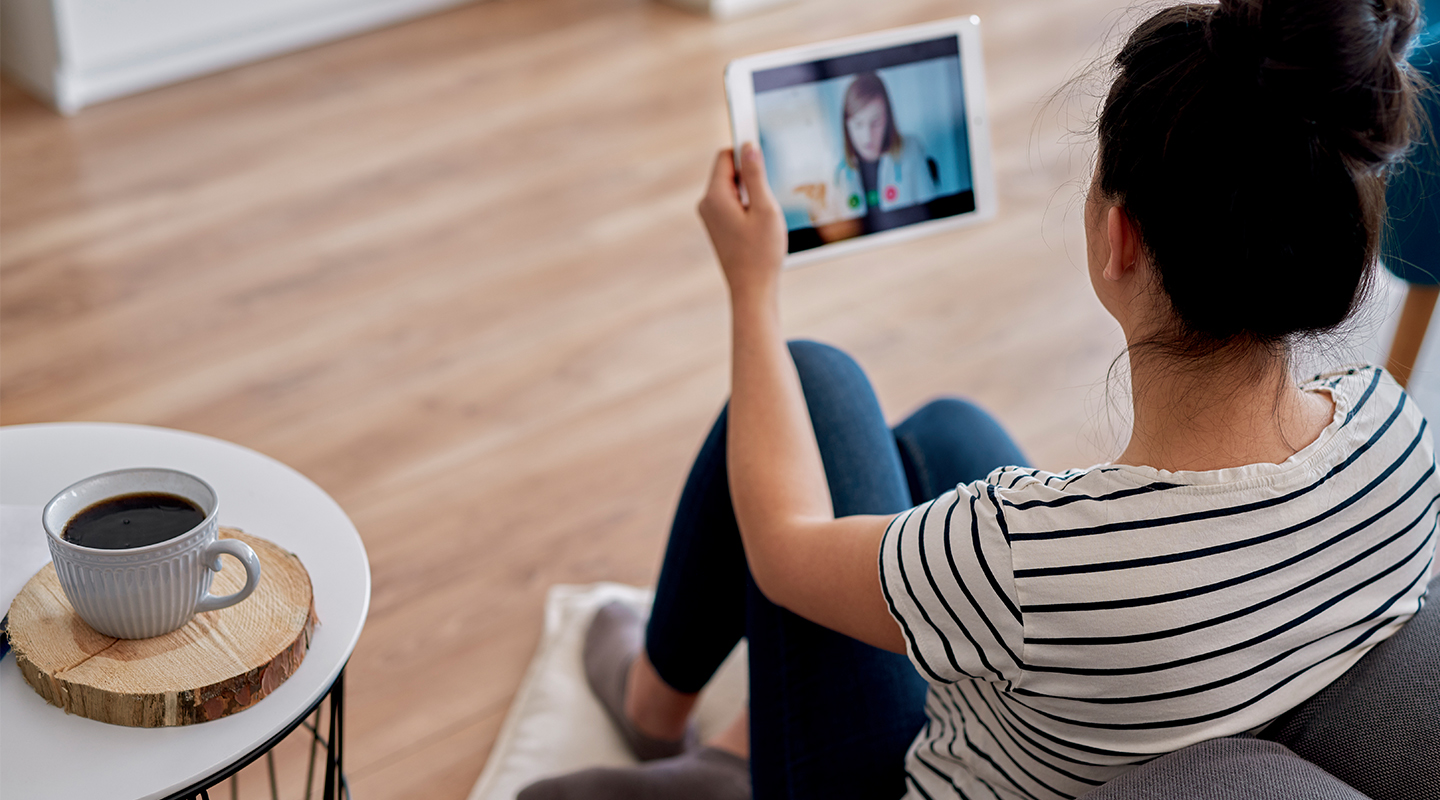 Unidentified female uses telehealth on a tablet