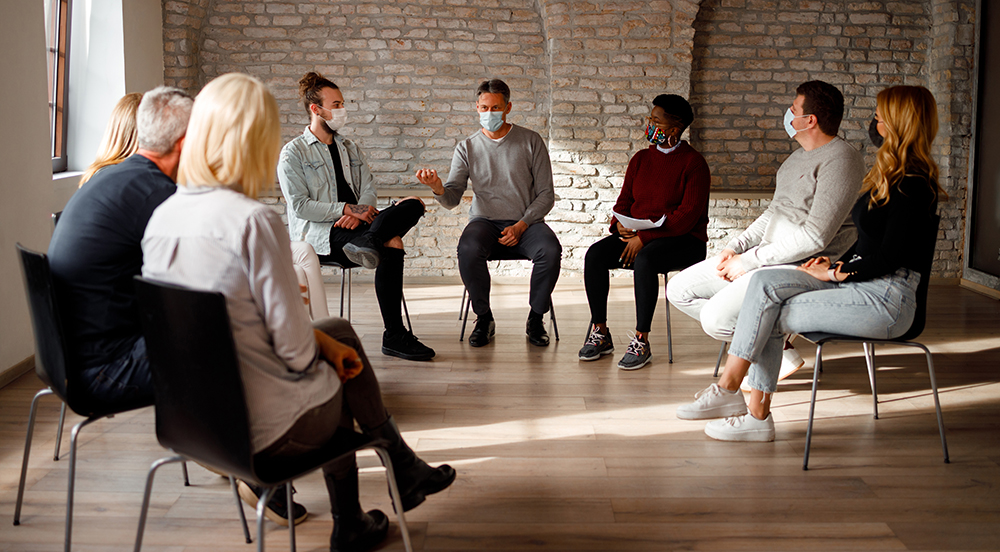 Diverse group listening during group therapy