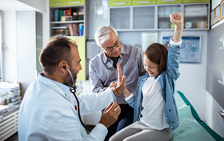 Young female high fives medical professional at the office