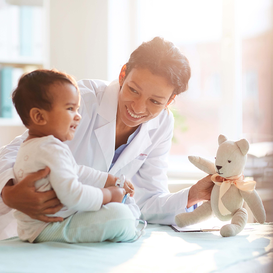 Pediatrician playing with patient