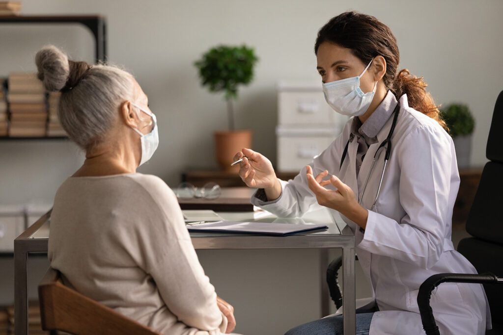 Image of patient and doctor talking