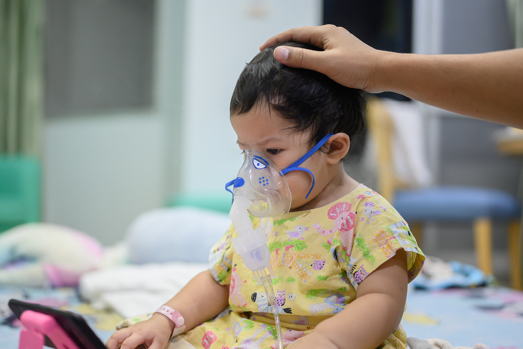 Young girl receiving oxygen.