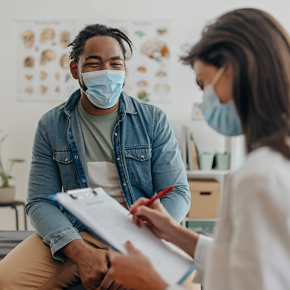 Man meets with health care provider