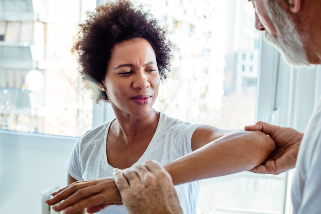 Physiotherapist working with a patient.