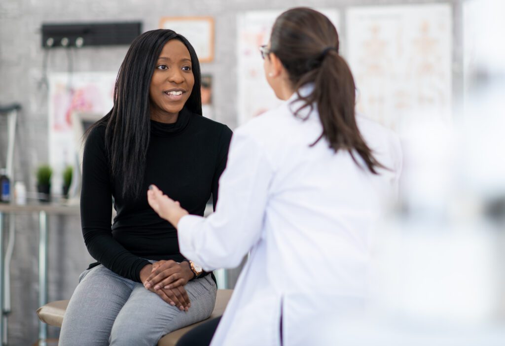 Female patient speaking with physician