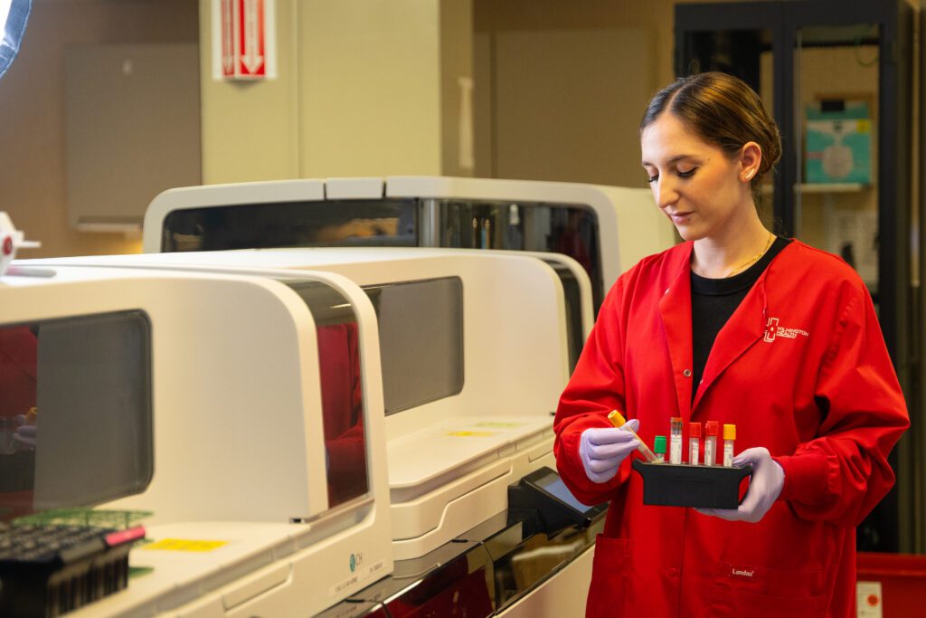 Lab tech carries samples