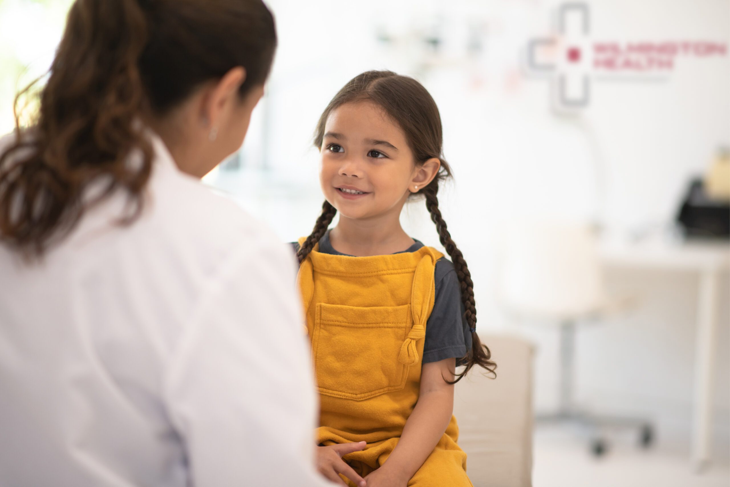 Little girl meets with her pediatrician