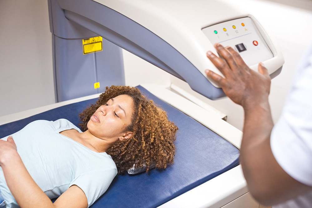 Woman undergoing bone density scan