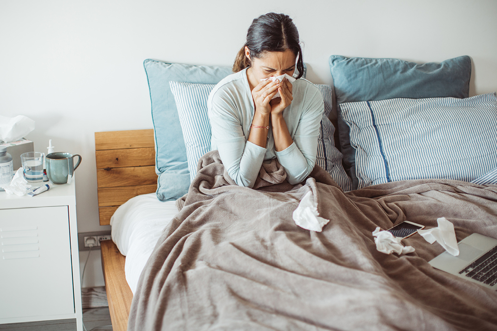 Woman sick in bed