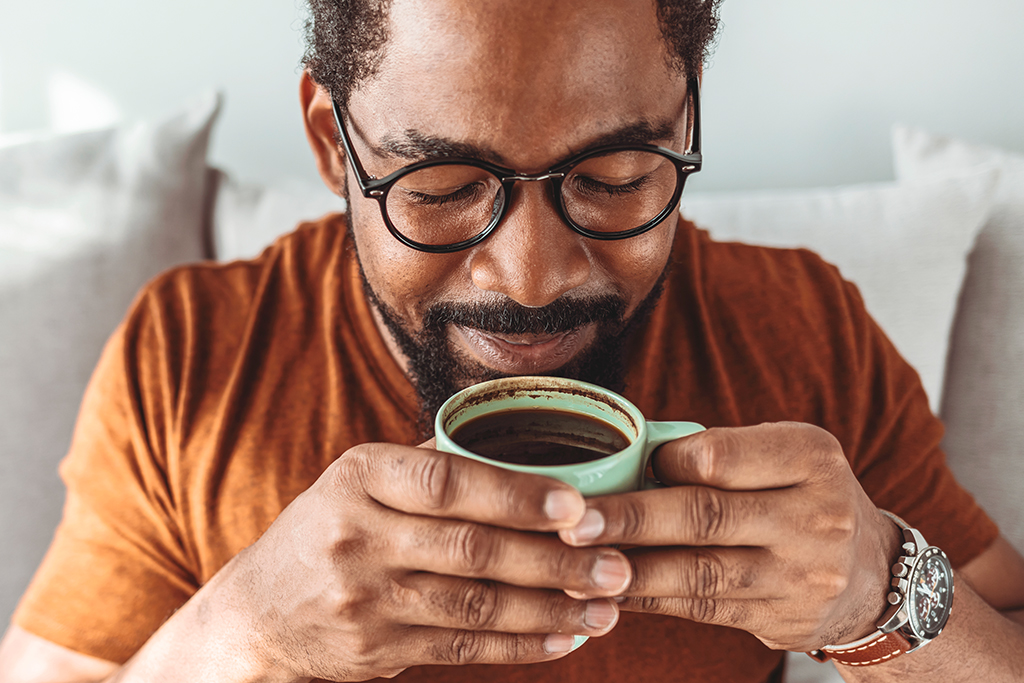 Man holding a cup of coffee